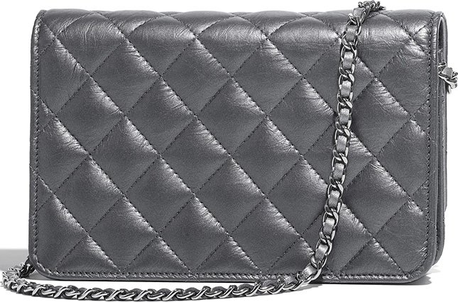 Chanel Classic Quilted WOC With Signature Charm 2